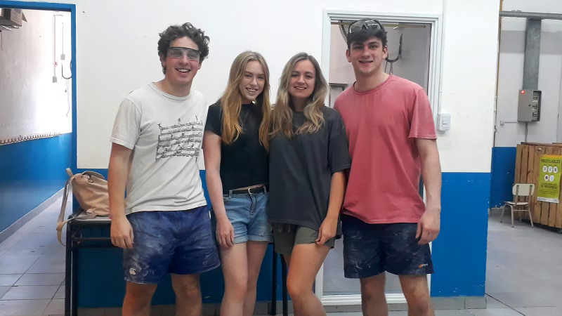 Four IVHQ Volunteers standing next to their completed work