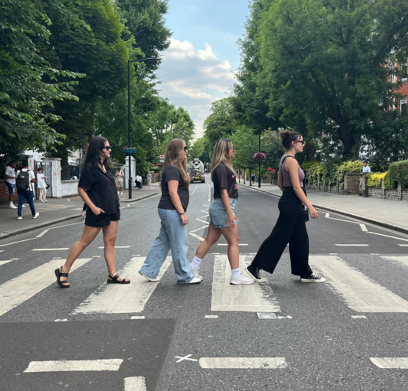Four students on Abbey Road. 