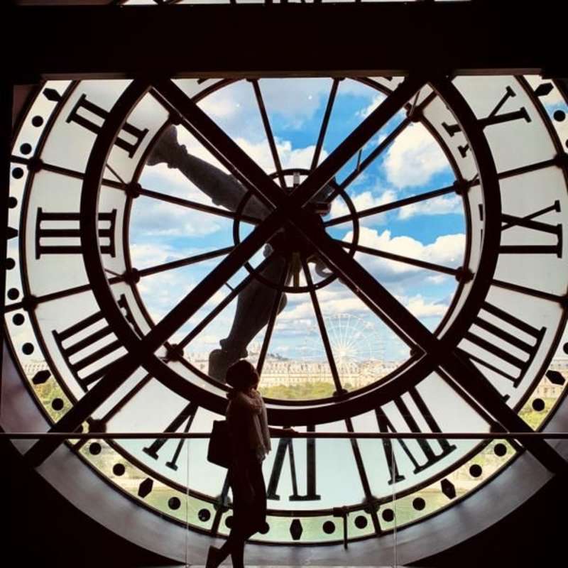Student in front of Paris Clock