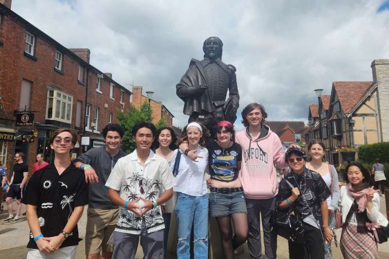 FYA students in Statford next to statue