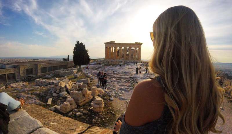 Girl in greece looking at ruins