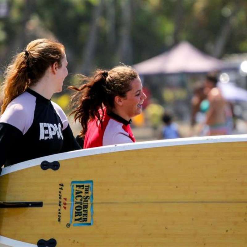 Girls with surfboard in Puerto Escondido, Mexico