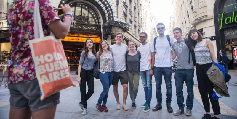 group of people taking picture in the city