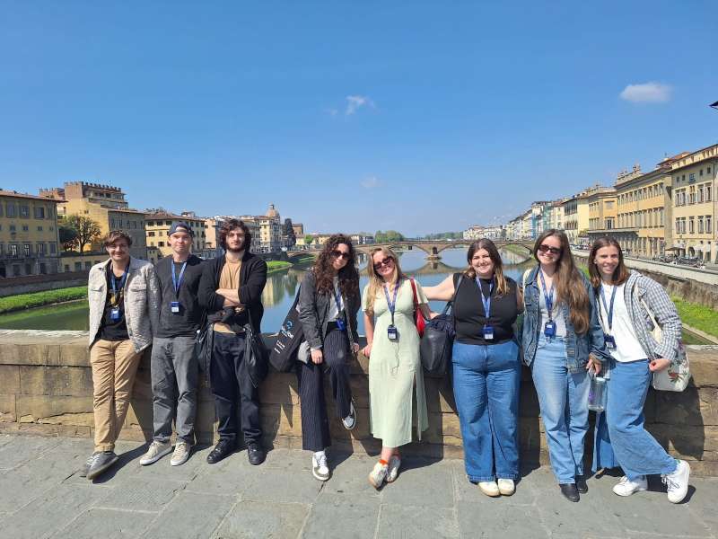 Group of students in front of river in Florence