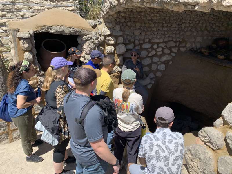 volunteers with a tour guide