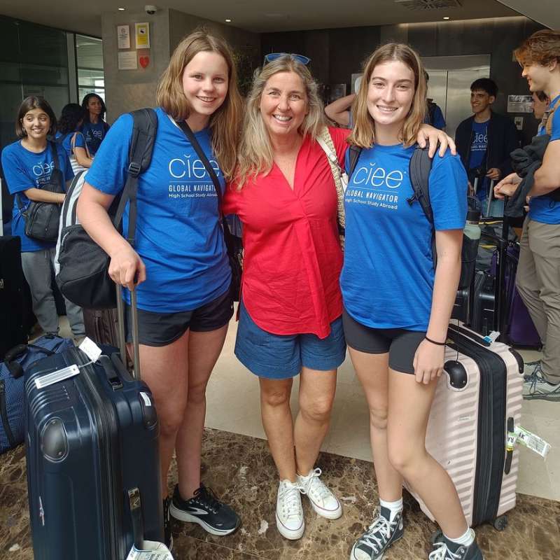 High school participants with their host at the airport in Seville
