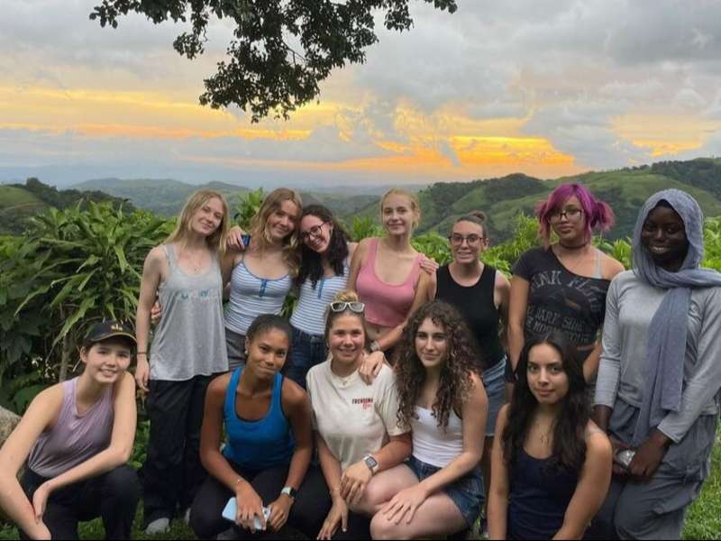 High schoolers on program in Monteverde posing for sunset group photo