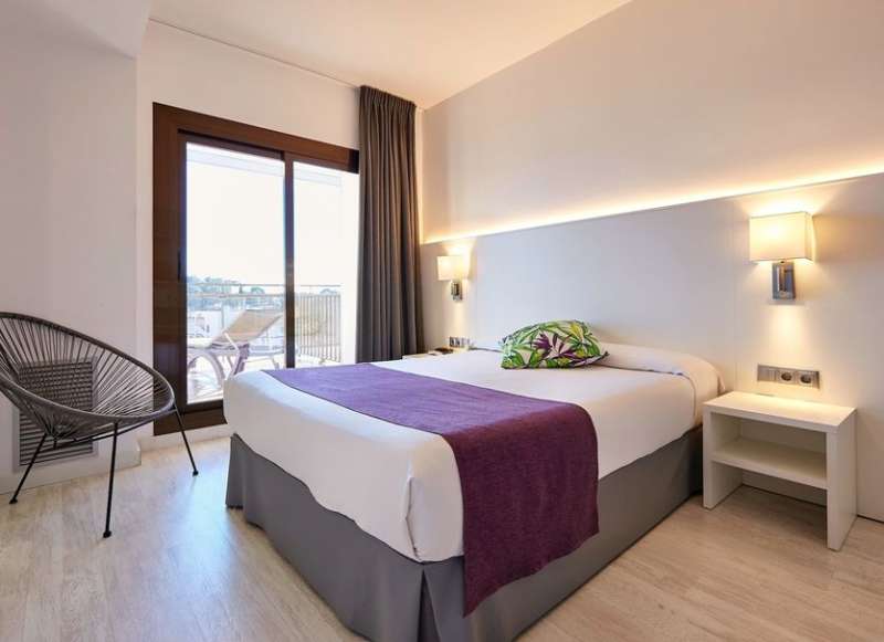 hotel room with bed and veranda