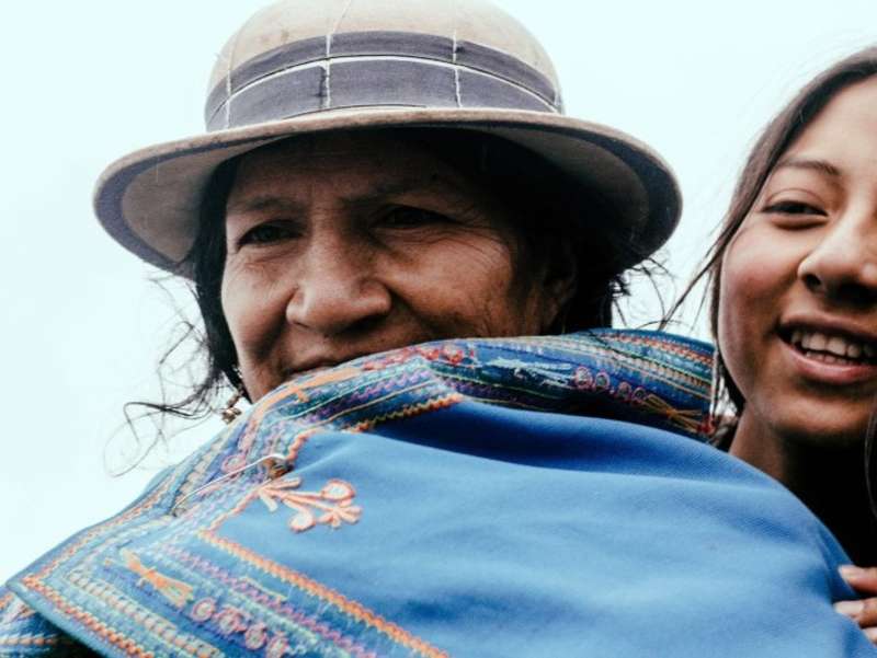 indigenous-elder-woman-volunteer-embrace
