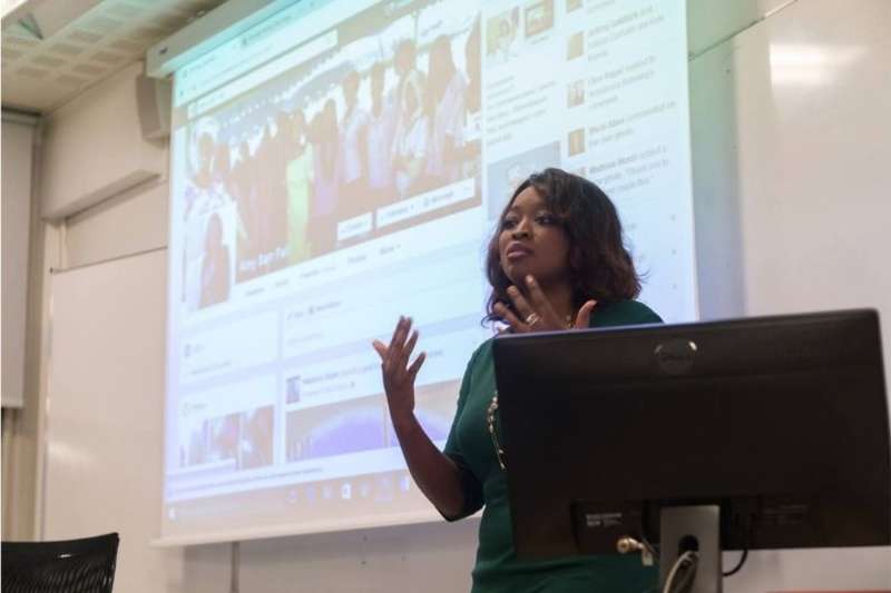 instructor lecturing at the American University of Paris