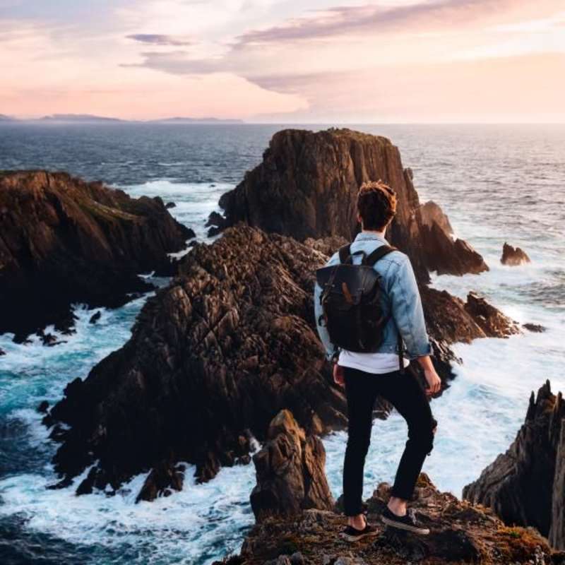 Man on top of a cliff