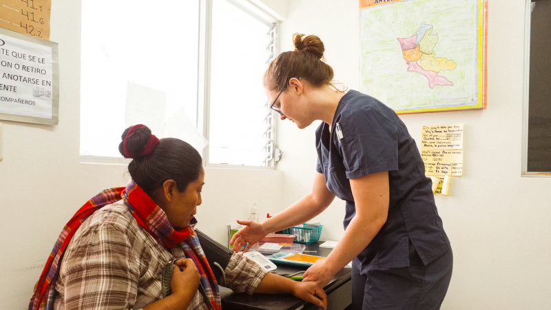 IVHQ Medical Campaign Volunteer Providing Care to a Local Citizen