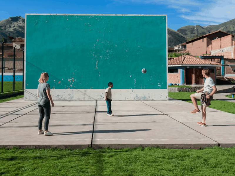 IVHQ Volunteers Playing Football with a Local Child in Jamaica 