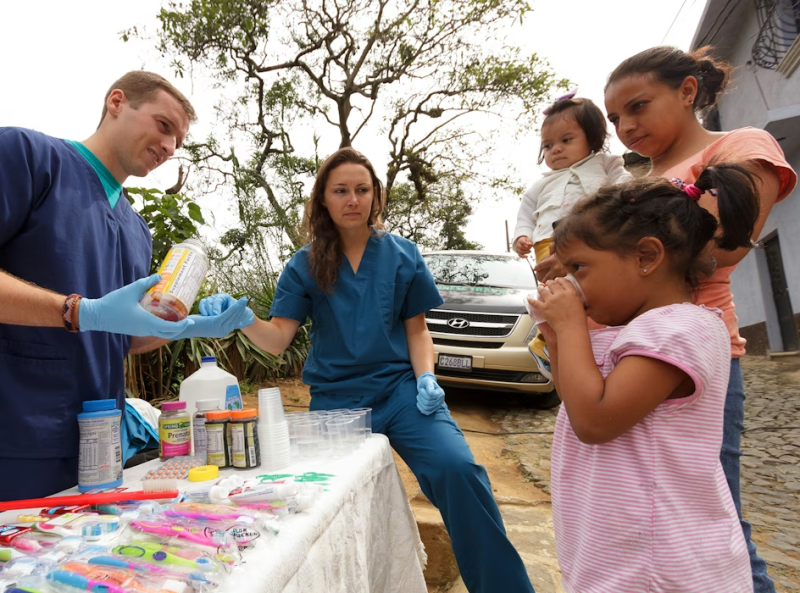 IVHQ Volunteers Providing Medication to Children in Antigua Guatemala
