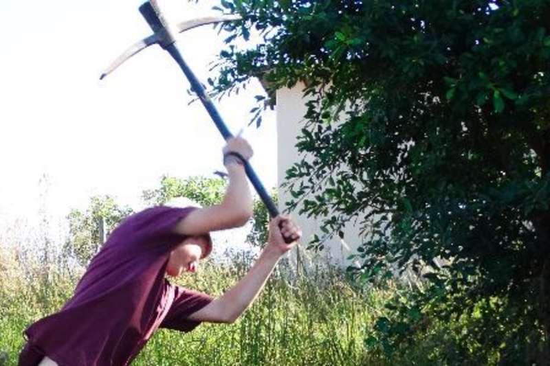 Volunteer using an axe