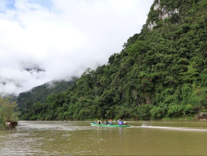 Local longboat ride in rural jungle village in Laos