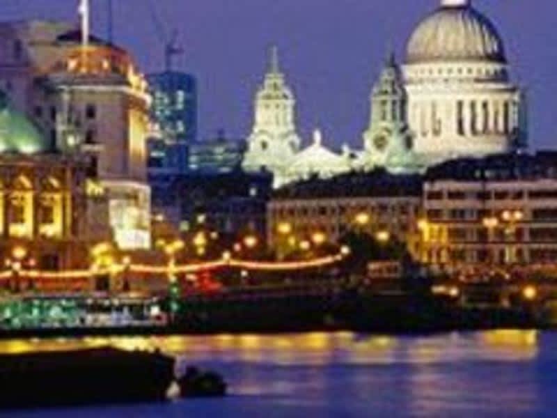 London, England at night: A stunning view of the cityscape with illuminated buildings and a vibrant night sky.