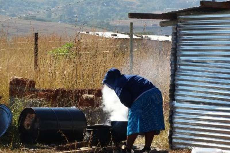 Woman cooking for pre-school students