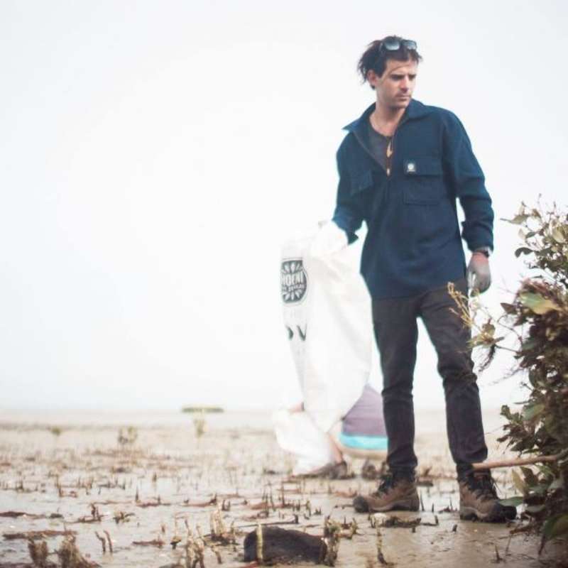 a volunteer helping on coastline conservation