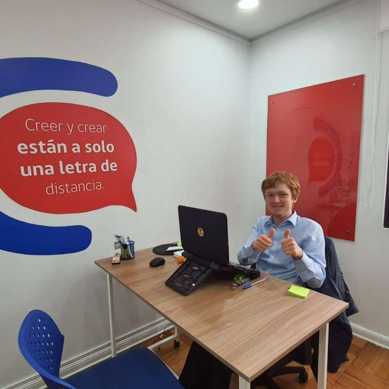 One of our interns at his desk in Chile!