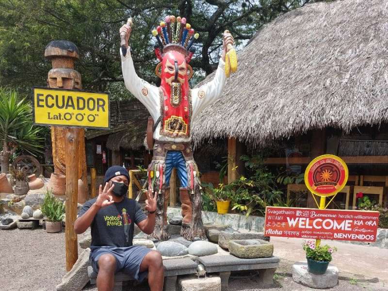 One of our interns posing in front of an Ecuador statue!