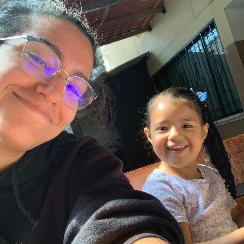 One of our interns posing with a student in Ecuador