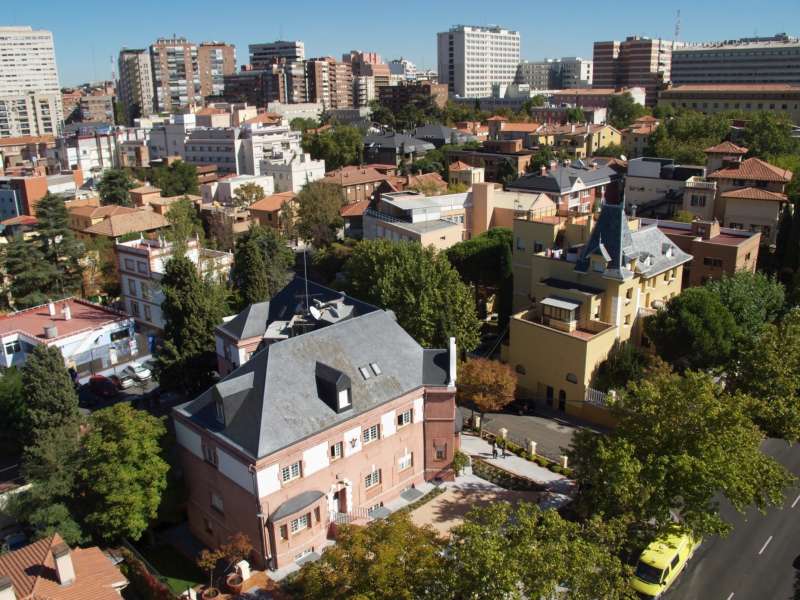 Overhead photo of Padre Arrupe Hall with the city in the background.
