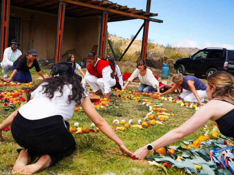 participants-kneeling-mandala-joined-hands