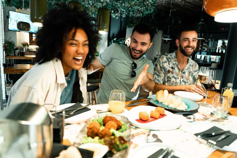 people laughing around a table