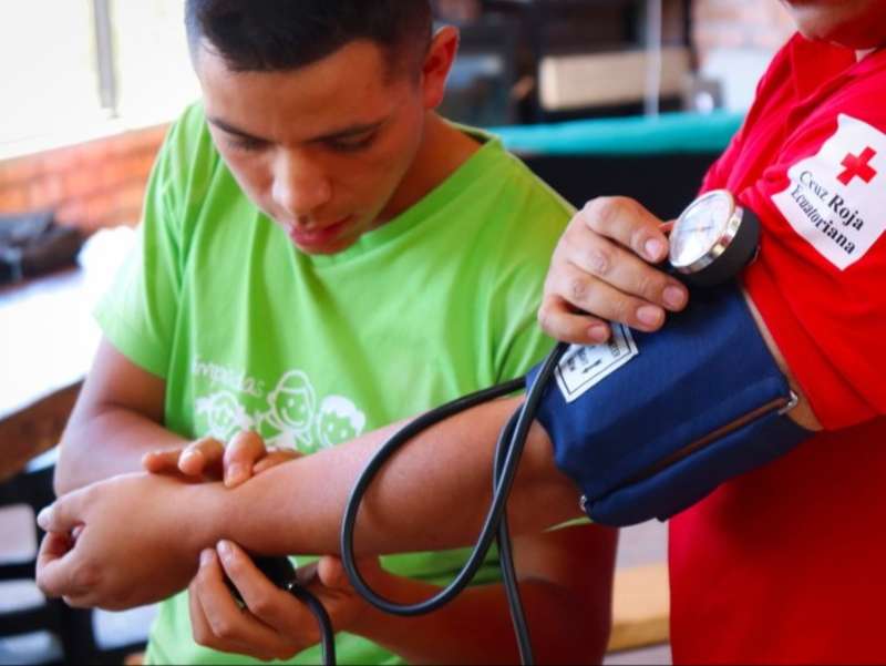 red-cross-blood-pressure-check-volunteer-ecuador