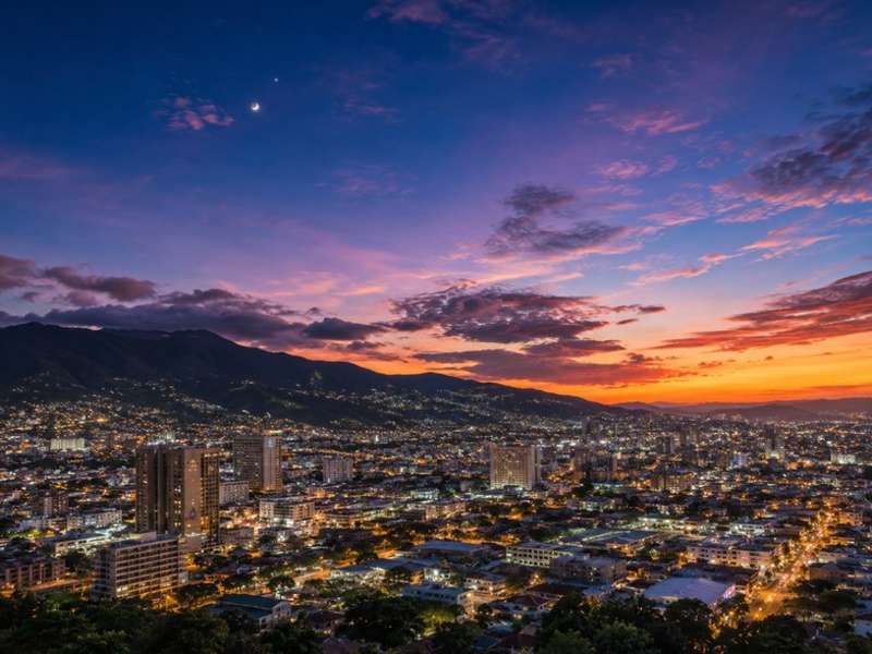 San Jose skyline illuminated beneath a colourful sunset