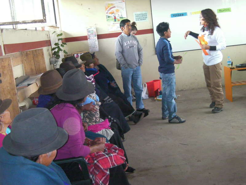 volunteer talking  to many locals
