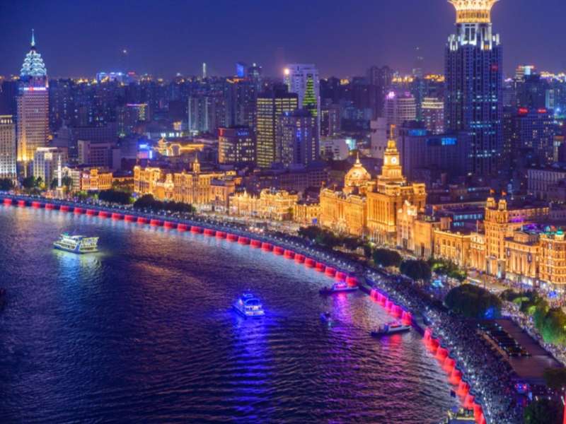 Shanghai city shoreline lit up at night