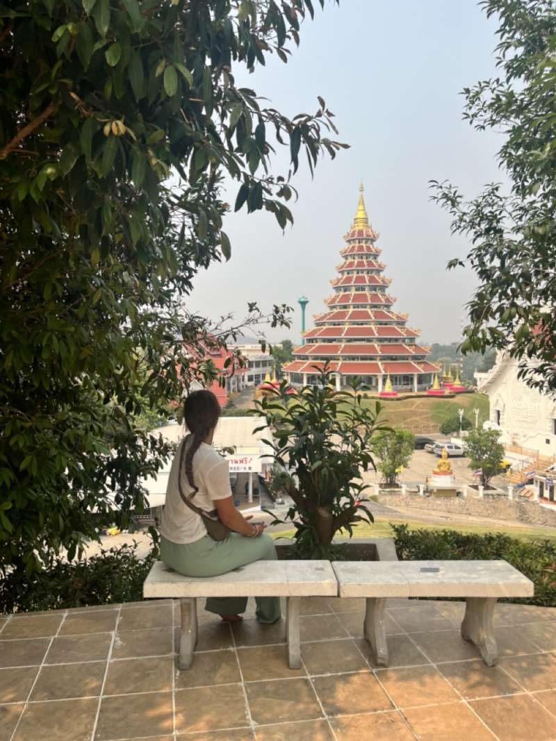 sitting and looking at a temple