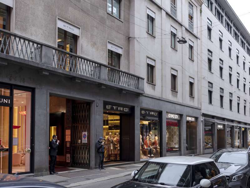Street with apartments, shop fronts, windows and balconies