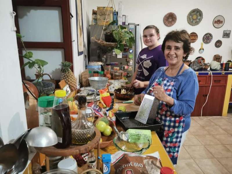 Student cooking with homestay family