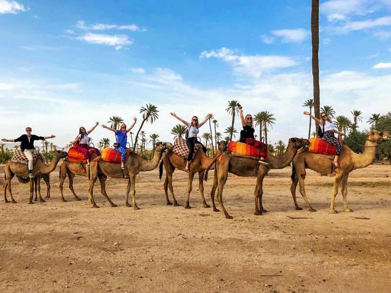Student doing a camel ride in Morocco
