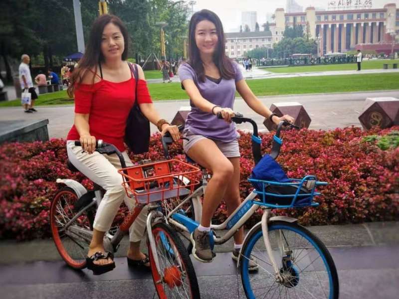 Student exploring Chengdu with her teacher
