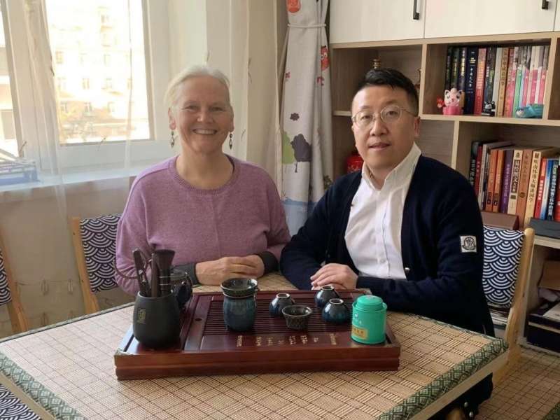 Student exploring Chinese culture with her teacher in Dalian