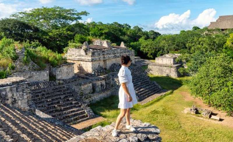 Student exploring Mayan ruins