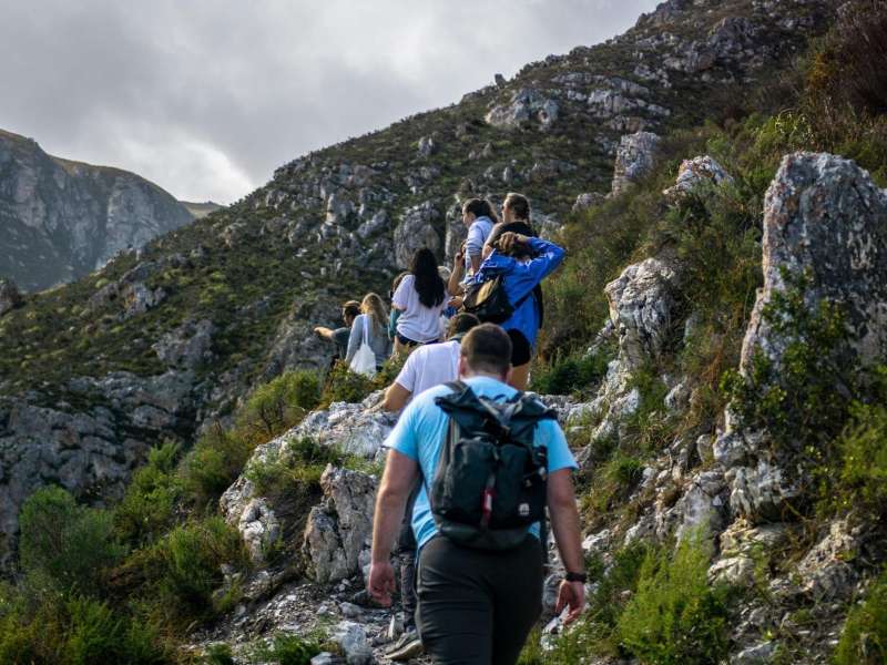 Student group hikes a mountainscape in Cape Town