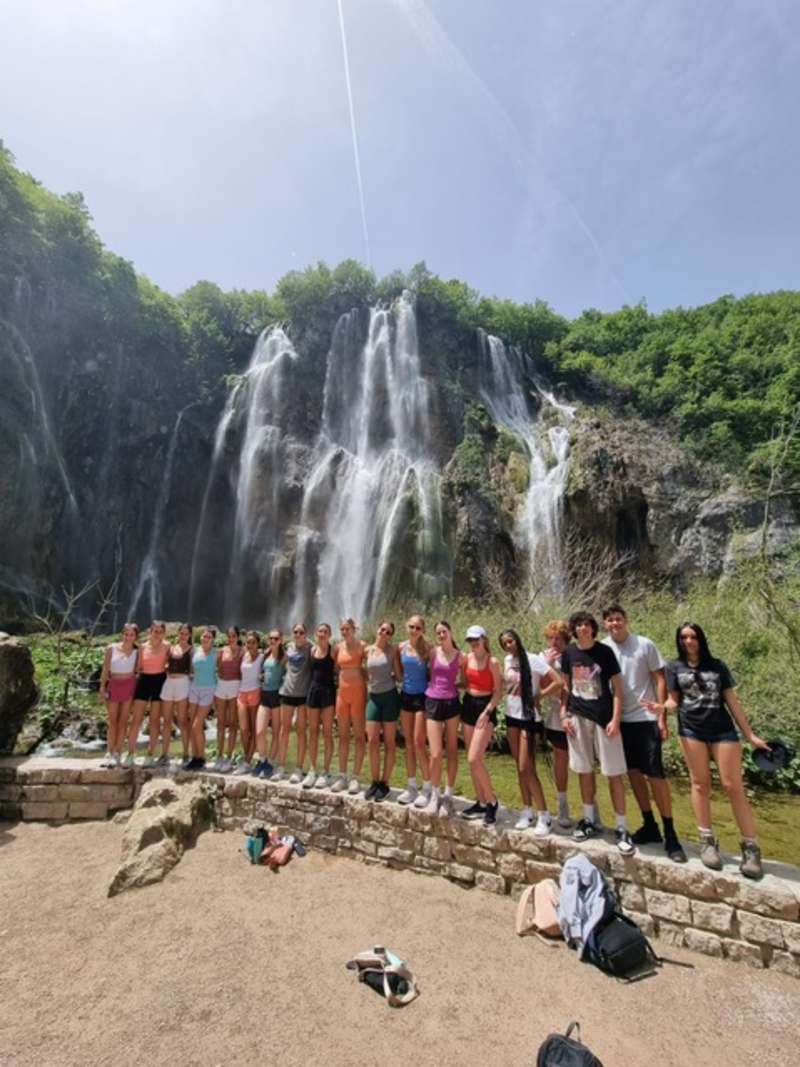 Student group in front of a waterfall in Croatia