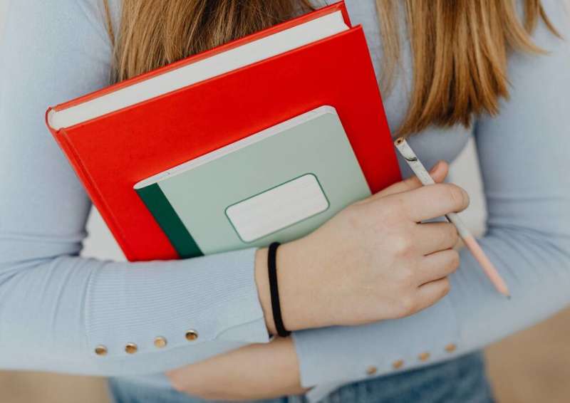 Student holding books