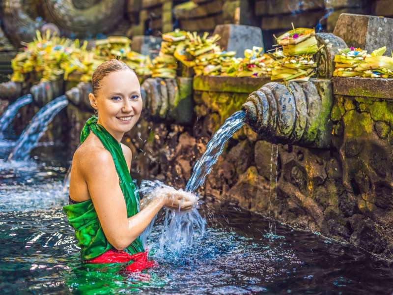 Student in spring at Indonesian temple