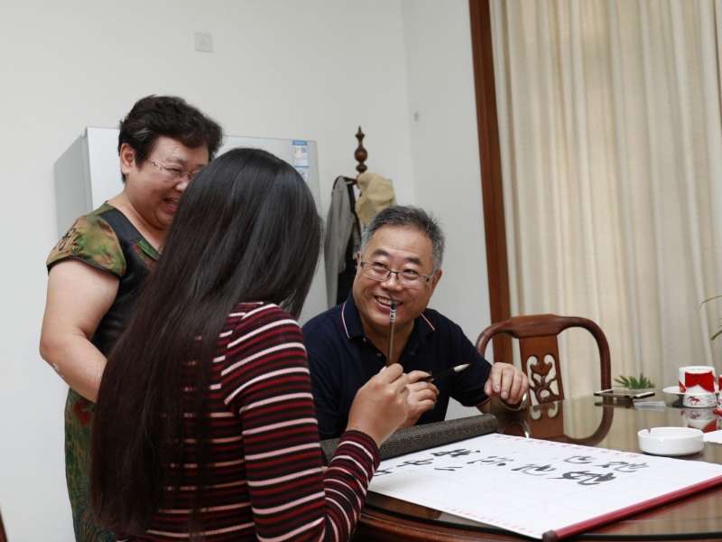 Student learning Chinese calligraphy in Shanghai