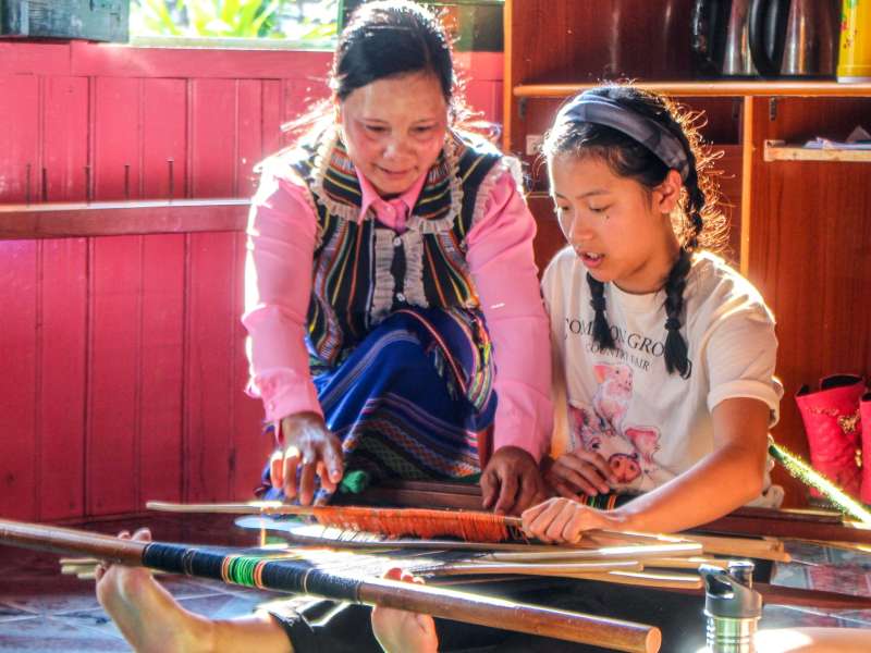 Student learning weaving in Vietnam