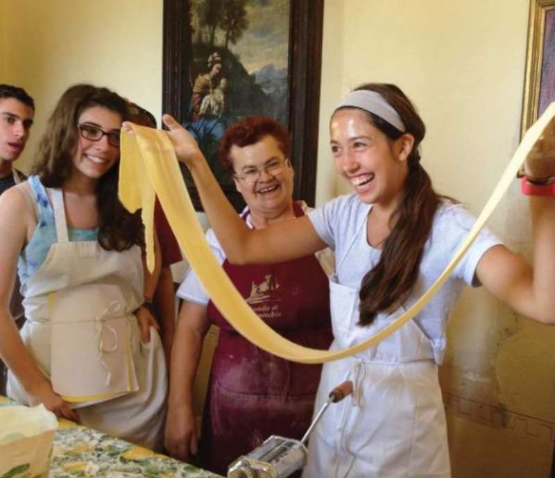 student making pasta in italy