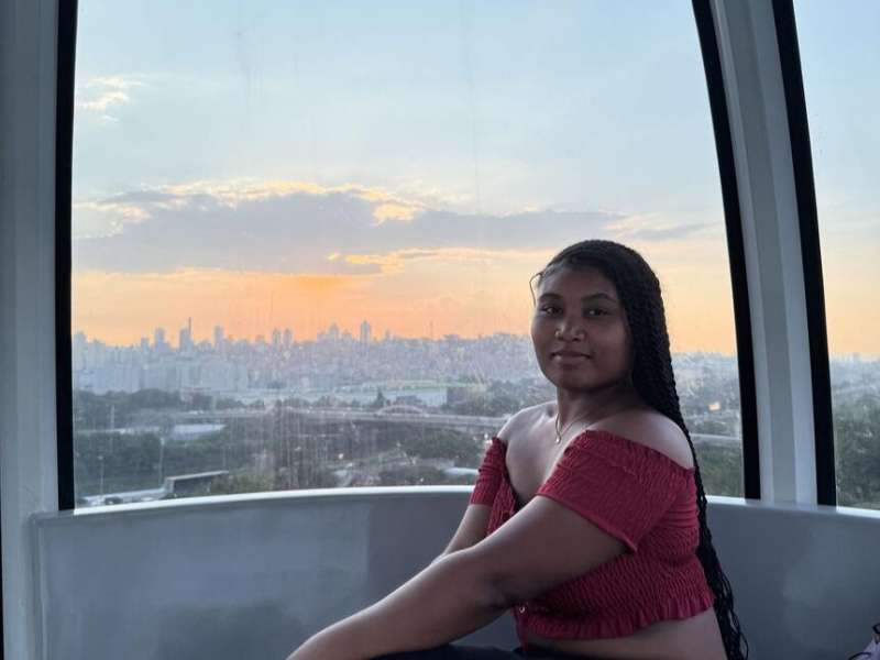 Student on ferris wheel in Sao Paulo