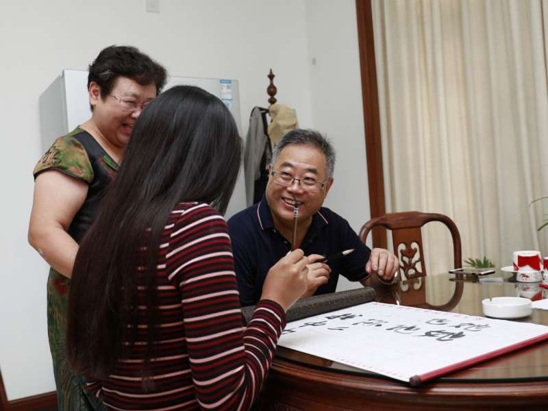 Student practising Chinese calligraphy in Shanghai