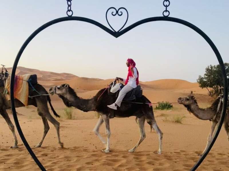 Student riding camel in Rabat